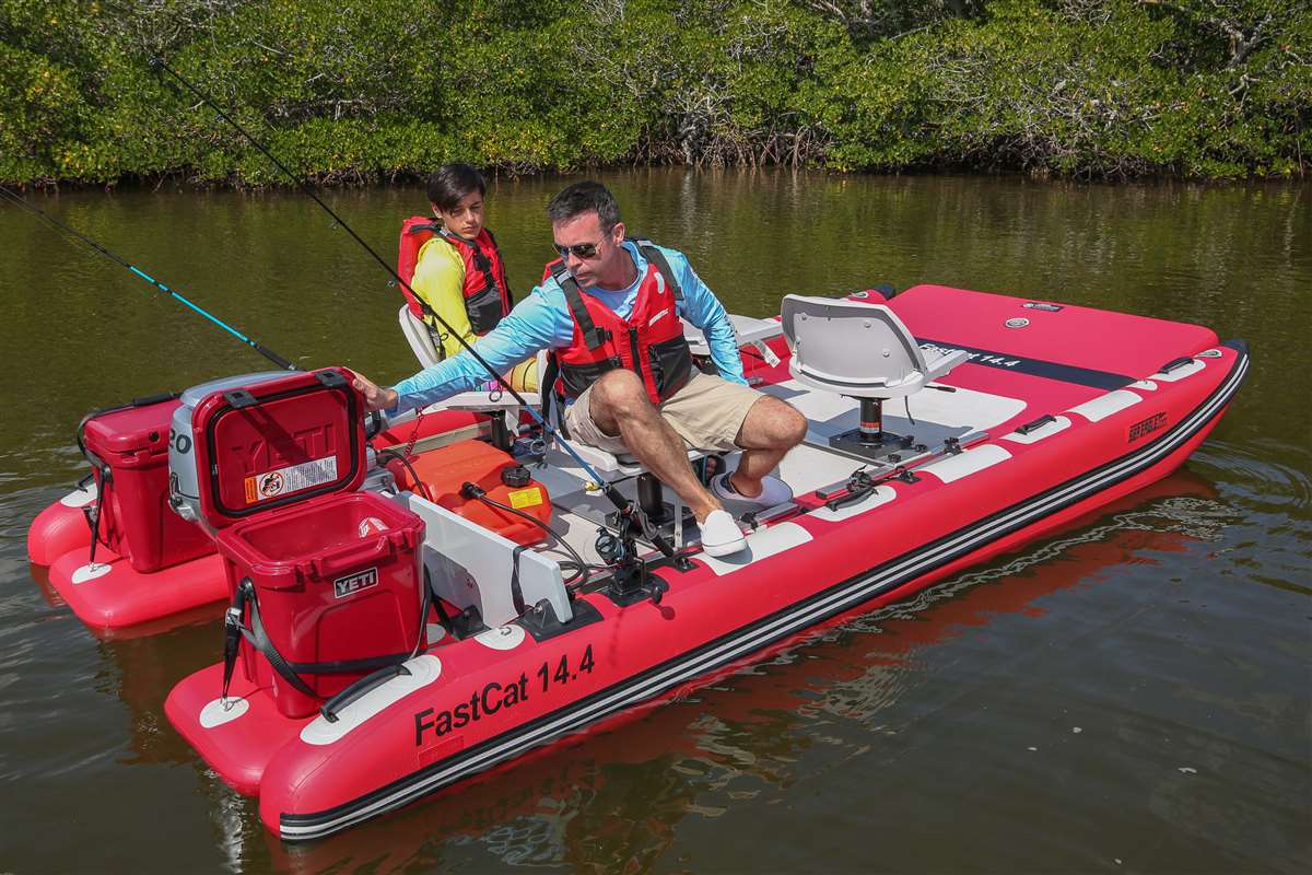 This family style FastCat14™ catamaran pontoon boat has room to secure up to (2) 54 gallon coolers