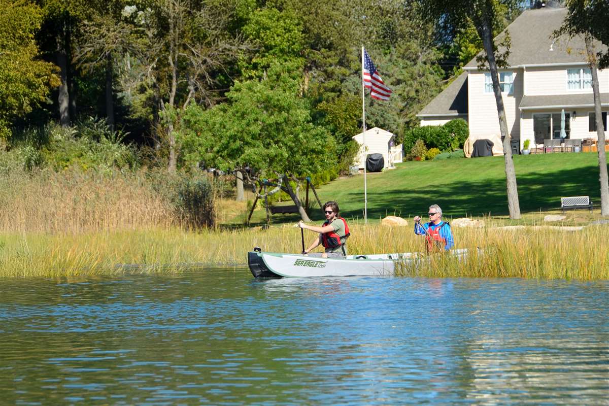 The red, white, and blue, and TC16 inflatable canoe